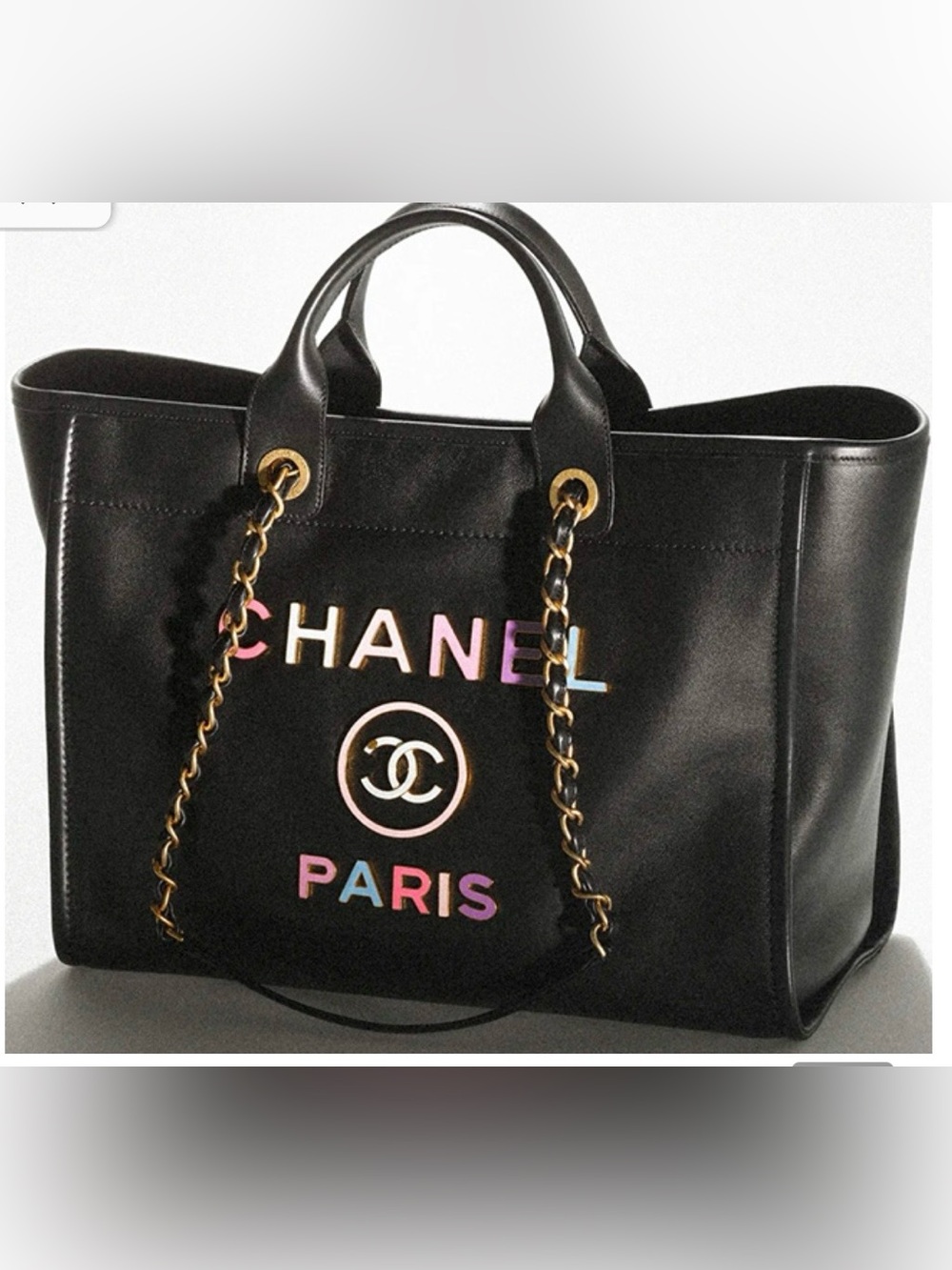 Black Leather Tote with Multicolor Logo and Gold Chain Handles.